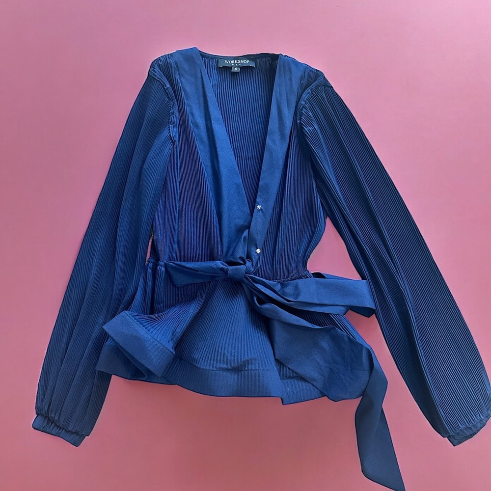 Brand new without tags peplum top in navy blue color.